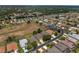 Aerial view of a residential neighborhood showcasing a community with mature trees and well-maintained homes at 1748 Sw 157Th Place Rd, Ocala, FL 34473