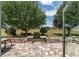 Charming backyard brick patio with views of lush green lawn and mature trees at 1748 Sw 157Th Place Rd, Ocala, FL 34473