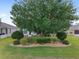 Lush backyard featuring mature trees and manicured landscaping, creating a serene and private outdoor space at 1748 Sw 157Th Place Rd, Ocala, FL 34473