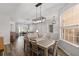 Open concept dining area with modern lighting and seamless access to the living room at 1748 Sw 157Th Place Rd, Ocala, FL 34473