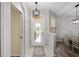 Inviting foyer featuring tile flooring, decorative glass front door, and open access to the dining area at 1748 Sw 157Th Place Rd, Ocala, FL 34473