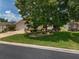 Inviting single-story home with a brick paver driveway, well-manicured lawn, and established shrubbery at 1748 Sw 157Th Place Rd, Ocala, FL 34473