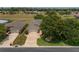 Lovely single Gathering home featuring a brick paver driveway, manicured lawn, and mature landscaping at 1748 Sw 157Th Place Rd, Ocala, FL 34473
