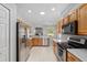 Beautiful kitchen with stainless steel appliances, lots of cabinets and an opening to the dining and living area at 1748 Sw 157Th Place Rd, Ocala, FL 34473