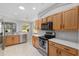 Beautiful kitchen with stainless steel appliances, lots of cabinets and an opening to the dining and living area at 1748 Sw 157Th Place Rd, Ocala, FL 34473