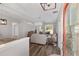 Open living room with modern decor, neutral tones, and hardwood flooring, viewed from the front door at 1748 Sw 157Th Place Rd, Ocala, FL 34473