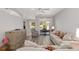 Bright living room with wood floors, a ceiling fan, and comfortable seating at 1748 Sw 157Th Place Rd, Ocala, FL 34473