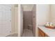 Tiled shower featuring built-in seat, shower head, and storage niche providing a convenient and modern showering experience at 1748 Sw 157Th Place Rd, Ocala, FL 34473