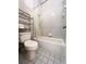 A full bathroom with tiled walls, a shower and bathtub combination, and a toilet at 21 Pecan Course Cir, Ocala, FL 34472