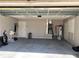 An empty garage with a water heater and other utility units at 21 Pecan Course Cir, Ocala, FL 34472
