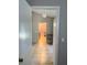 A view of the kitchen from a doorway with views of the dining room beyond at 21 Pecan Course Cir, Ocala, FL 34472