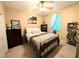 Cozy bedroom with a comfortable bed, bedside table and decor at 231 Ne 28Th Ave # 207, Ocala, FL 34470