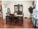 Formal dining room featuring hardwood floors, a stylish dining set, and elegant decor at 231 Ne 28Th Ave # 207, Ocala, FL 34470