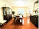 Open-concept dining room with ample natural light, hardwood floors, and traditional furniture at 231 Ne 28Th Ave # 207, Ocala, FL 34470