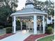 Community gazebo with seating area, surrounded by lush landscaping and sidewalks at 231 Ne 28Th Ave # 207, Ocala, FL 34470