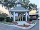Community gazebo with seating area, surrounded by landscaping and sidewalks at 231 Ne 28Th Ave # 207, Ocala, FL 34470
