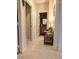 Hallway featuring a view to the bathroom, carpet floors, and neutral colored walls at 231 Ne 28Th Ave # 207, Ocala, FL 34470