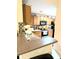 Modern kitchen with granite countertops, stainless steel appliances, and ample cabinet space at 231 Ne 28Th Ave # 207, Ocala, FL 34470