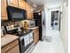 Well-equipped kitchen with stainless steel appliances and direct access to the laundry area at 231 Ne 28Th Ave # 207, Ocala, FL 34470