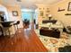 Comfortable living room featuring wood floors, modern decor, and bright, airy layout at 231 Ne 28Th Ave # 207, Ocala, FL 34470