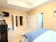 Another view of the carpeted main bedroom with closet and attached bathroom access at 231 Ne 28Th Ave # 207, Ocala, FL 34470