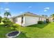 Backyard features a well-maintained lawn, mature trees, and a tranquil atmosphere at 3141 Roswell Rd, The Villages, FL 32162