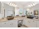 Elegant bathroom with dual vessel sinks, granite countertops, and custom white cabinetry offering style and functionality at 3141 Roswell Rd, The Villages, FL 32162