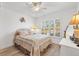 Cozy bedroom with a comfortable bed, plantation shutters, and a soft color palette, creating a relaxing retreat at 3141 Roswell Rd, The Villages, FL 32162