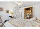 Bright bedroom with a bookshelf and a comfortable bed, ideal for relaxation and reading at 3141 Roswell Rd, The Villages, FL 32162