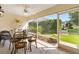 Sunroom with dining table and chairs with peaceful backyard views at 3141 Roswell Rd, The Villages, FL 32162