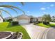 Attractive single-story home boasts a two-car garage, and a beautifully landscaped lawn at 3141 Roswell Rd, The Villages, FL 32162