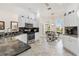 Bright kitchen area with stainless appliances, granite countertops, and breakfast table at 3141 Roswell Rd, The Villages, FL 32162