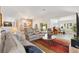Open-concept living area features hardwood floors, natural light, and easy access to recreation area at 3141 Roswell Rd, The Villages, FL 32162