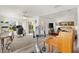 Recreation area showcasing open floorplan, hardwood floors, and views to the backyard at 3141 Roswell Rd, The Villages, FL 32162