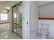 Bright bathroom featuring a toilet and mirrored closet doors reflecting the bedroom at 3295 Se 56 Ave, Ocala, FL 34480