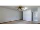 Bedroom with carpet, ceiling fan, and access to the bathroom at 3295 Se 56 Ave, Ocala, FL 34480