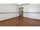 A bright, cozy room, with wood look floors, white walls, and a view of the yard at 3295 Se 56 Ave, Ocala, FL 34480
