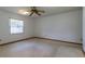 Bedroom with carpet, ceiling fan, and a bright window at 3295 Se 56 Ave, Ocala, FL 34480
