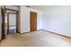 Bedroom featuring carpet flooring, white walls, and a door to another room at 3295 Se 56 Ave, Ocala, FL 34480