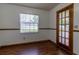 Bright breakfast nook featuring wood look floors and a glass panel door to the outside at 3295 Se 56 Ave, Ocala, FL 34480