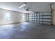 Spacious garage with concrete floor, natural light from windows, and an automatic door opener at 3295 Se 56 Ave, Ocala, FL 34480