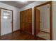 Hallway with wood-look flooring, closet, and access to other rooms at 3295 Se 56 Ave, Ocala, FL 34480