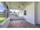 Enclosed screened porch with tile flooring and a ceiling fan offers a relaxing outdoor space at 3295 Se 56 Ave, Ocala, FL 34480