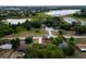 Aerial view of the property, showing its location within a neighborhood near a lake and lots of trees at 346 Emerald Rd, Ocala, FL 34472