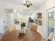 Bright dining area with views into the kitchen and white cabinetry at 346 Emerald Rd, Ocala, FL 34472