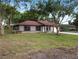 Charming single-story home featuring a well-maintained lawn and mature trees at 346 Emerald Rd, Ocala, FL 34472