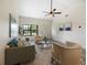 Bright living room with natural light, neutral décor and sleek ceiling fan at 346 Emerald Rd, Ocala, FL 34472
