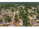 Aerial view of neighborhood with mature trees and well-maintained homes in a residential area at 3823 Se 49Th St, Ocala, FL 34480