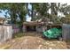 Backyard featuring a shed, garage with workshop space, and covered area for storage of equipment such as boats and trailers at 3823 Se 49Th St, Ocala, FL 34480