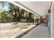 A view of the partially renovated backyard featuring an empty pool and covered patio at 3823 Se 49Th St, Ocala, FL 34480